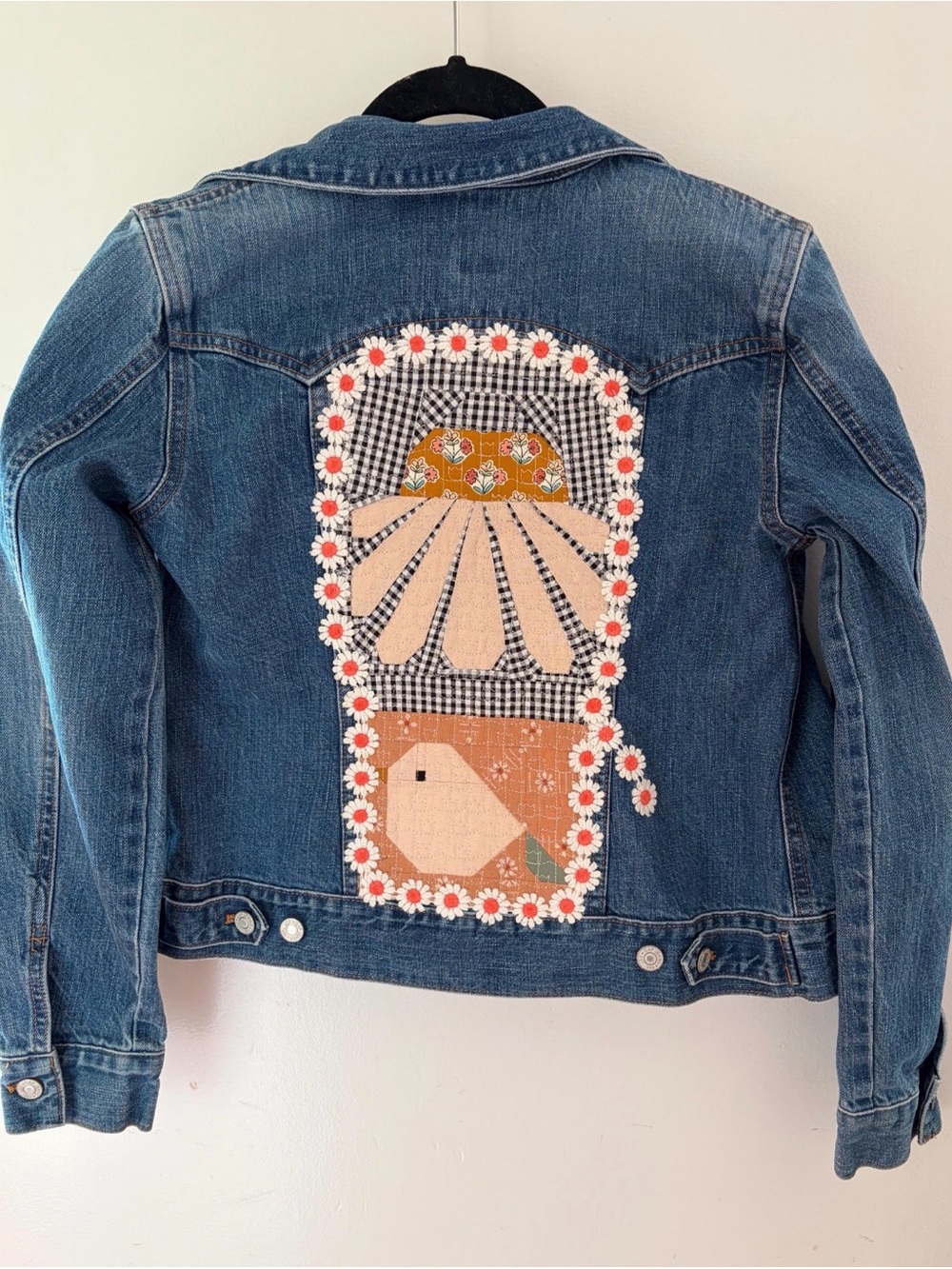 Upcycled Jean jacket with quilted coneflower and sparrow design